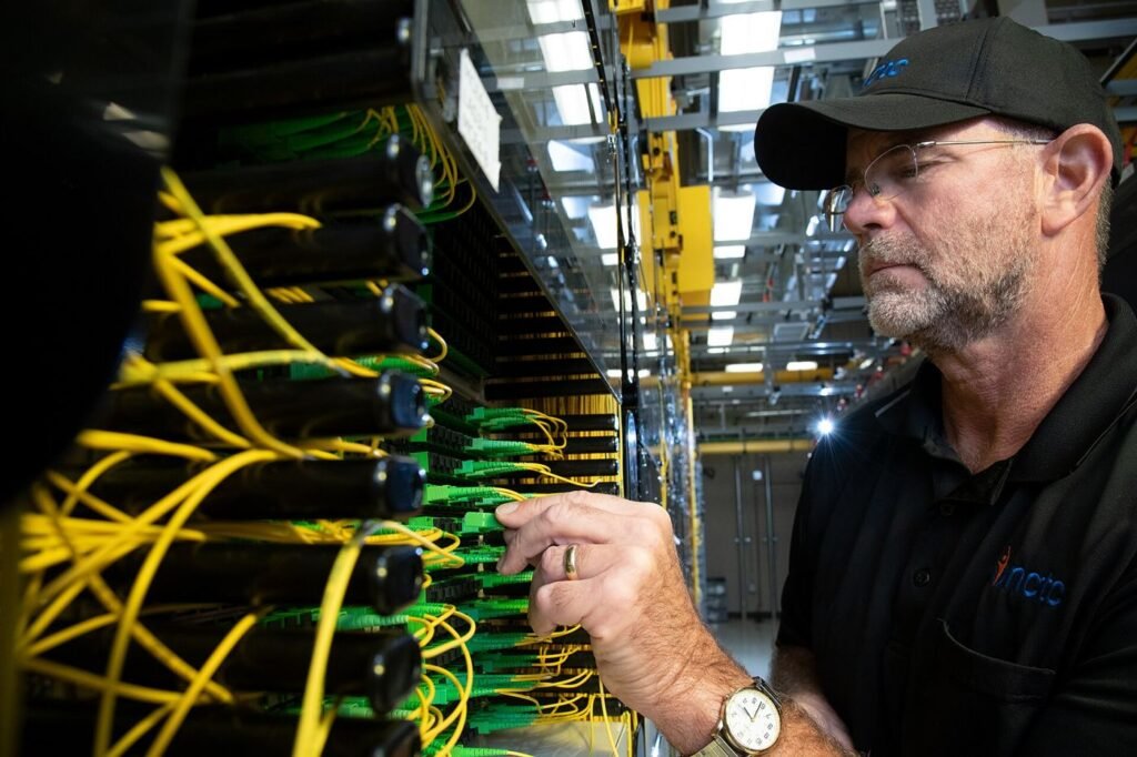 technician installing fibre optic cables