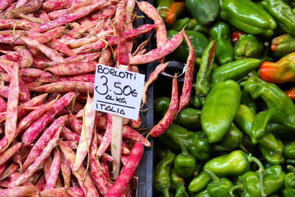 Food Inflation Keeps Pressure on Household Budgets Fresh vegetables on display at a busy food market