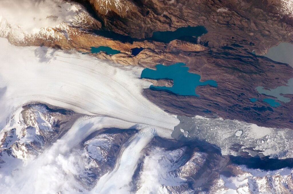 A glacial lake beneath ice-covered peaks