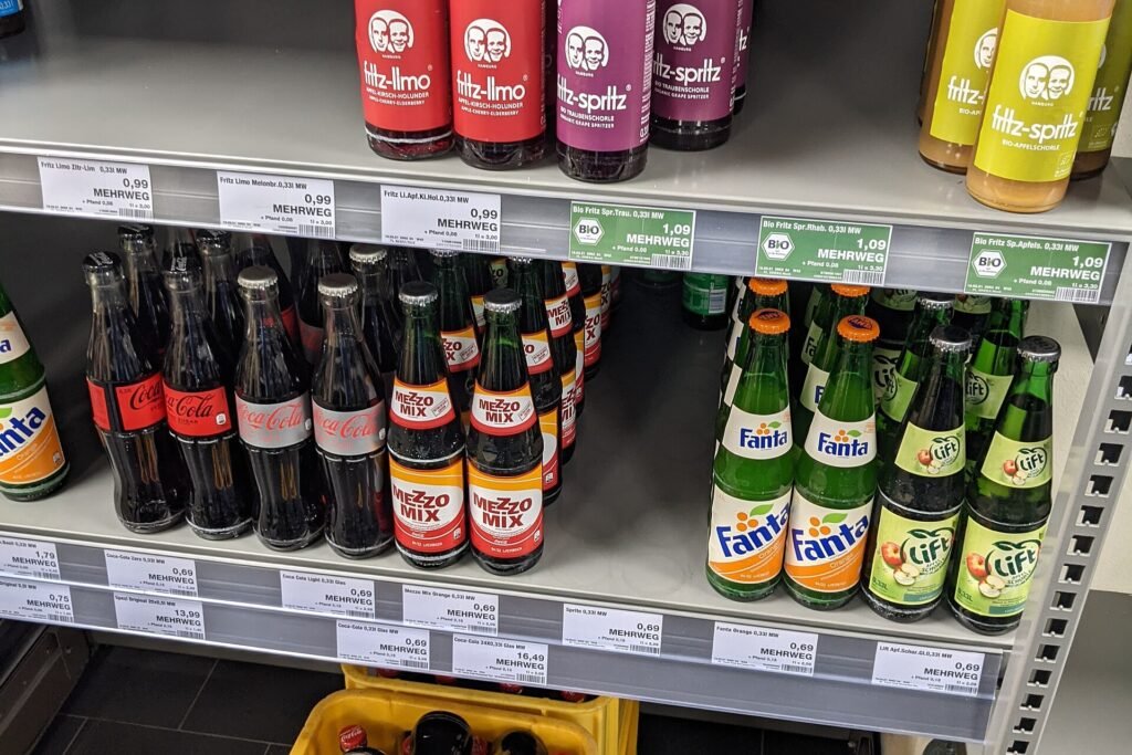 Papers Challenging Ultra-Processed Food Definition Often Tied to Industry Person reading food labels on packaged products in a supermarket